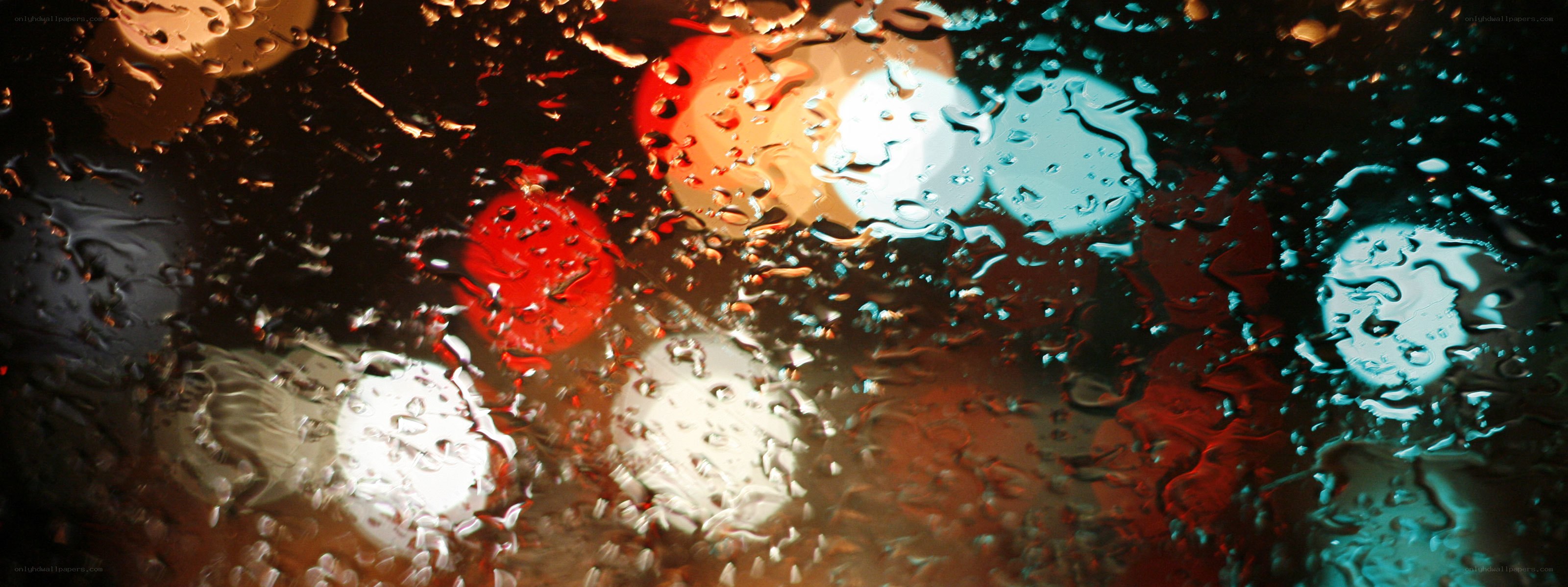 rainy night lights through glass