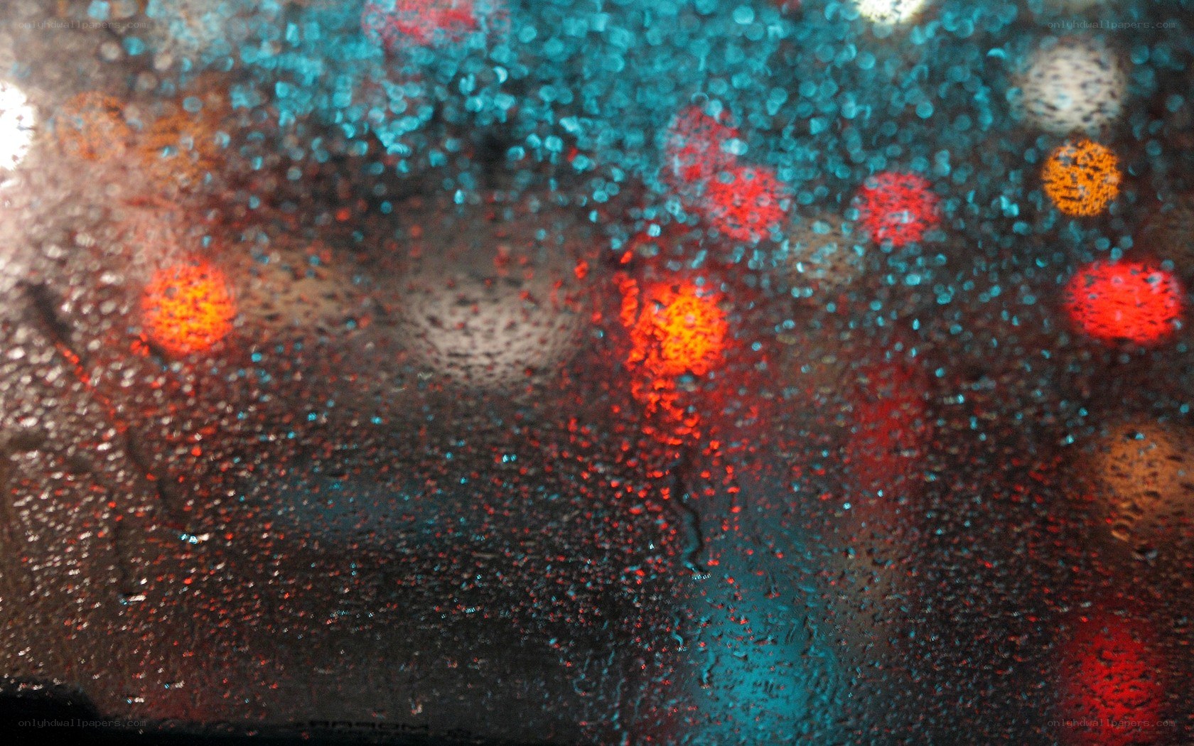 rainy night lights through glass