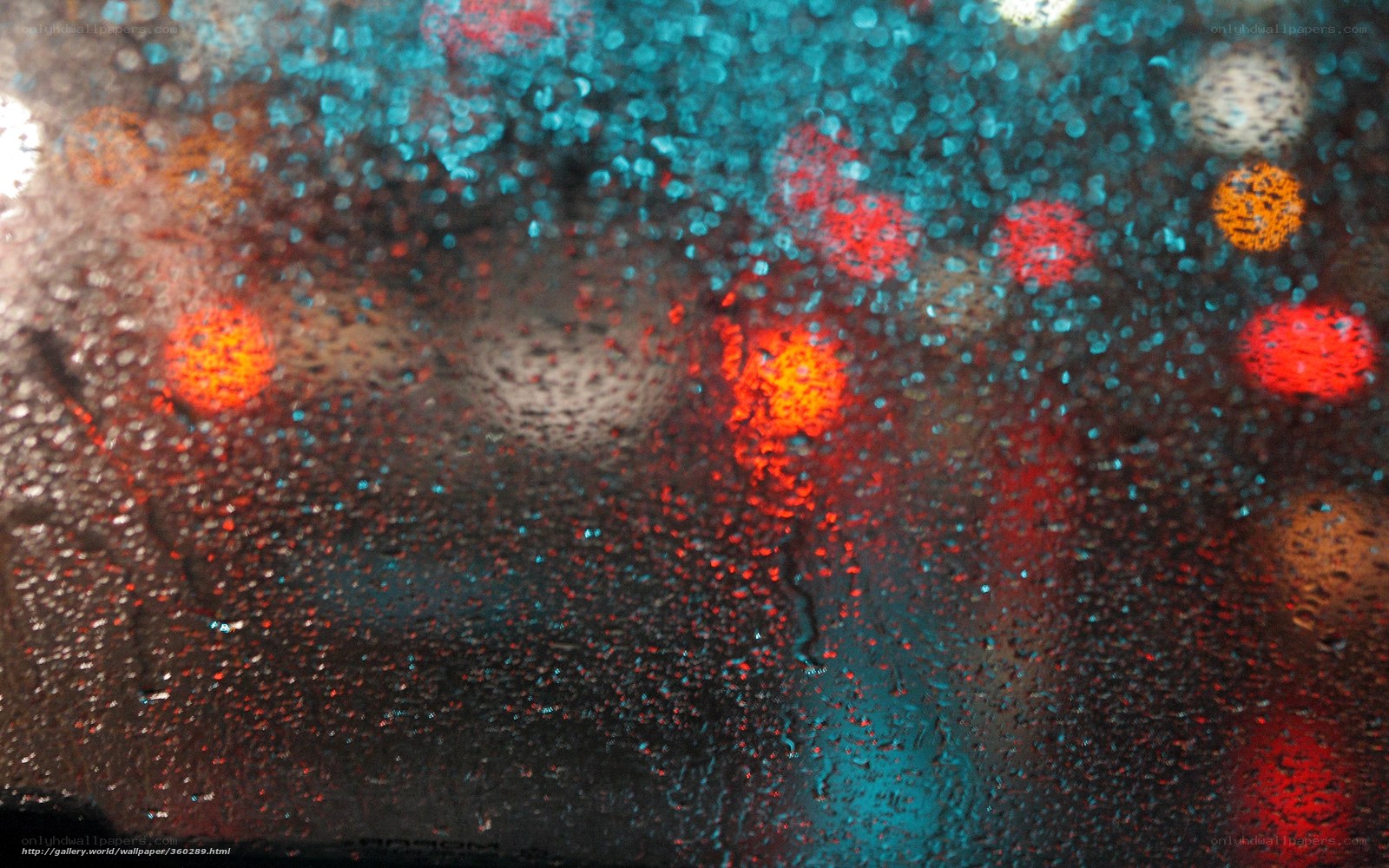 Rainy night lights through glass