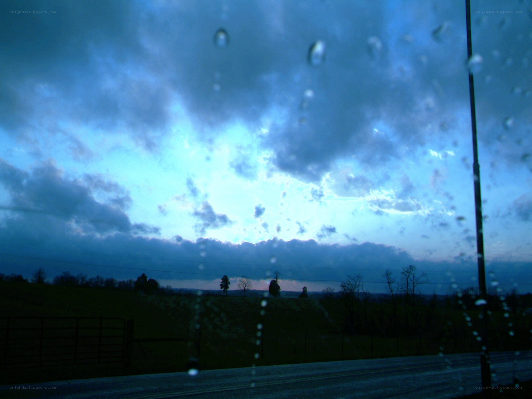 Rainy sky over rural landscape