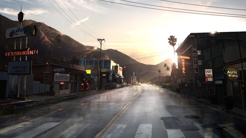 rainy street at sunset with mountains