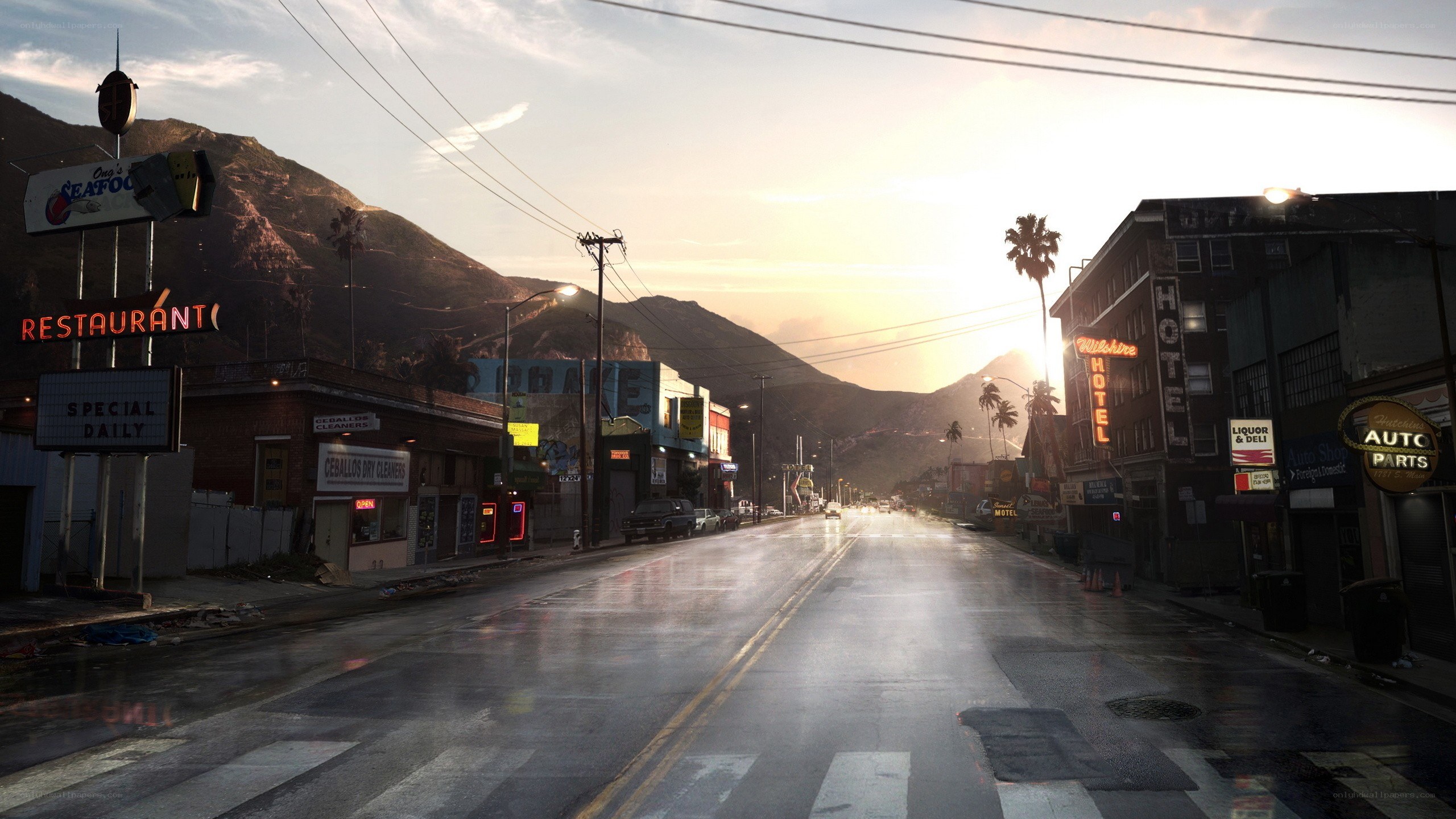 rainy street at sunset with mountains