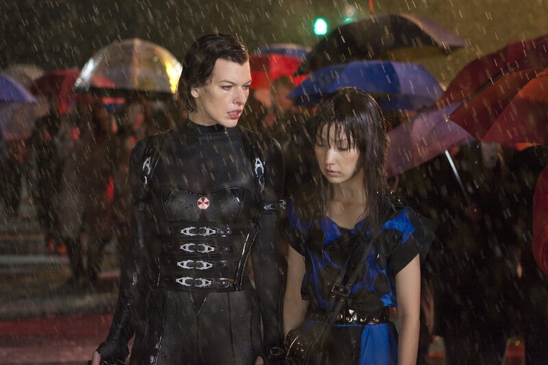 Rainy street scene with two women