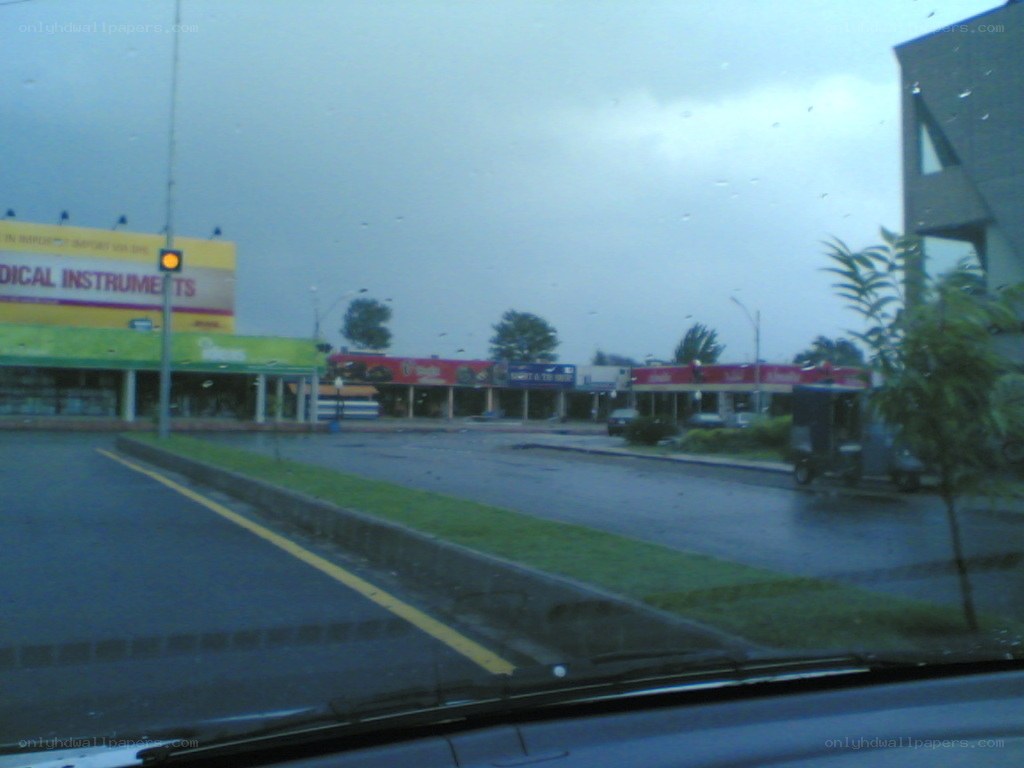 rainy street view from car