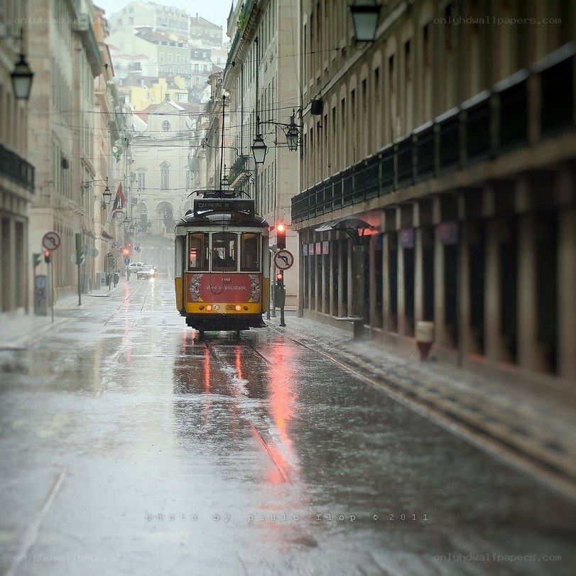 Rainy street with tram in Lisbon
