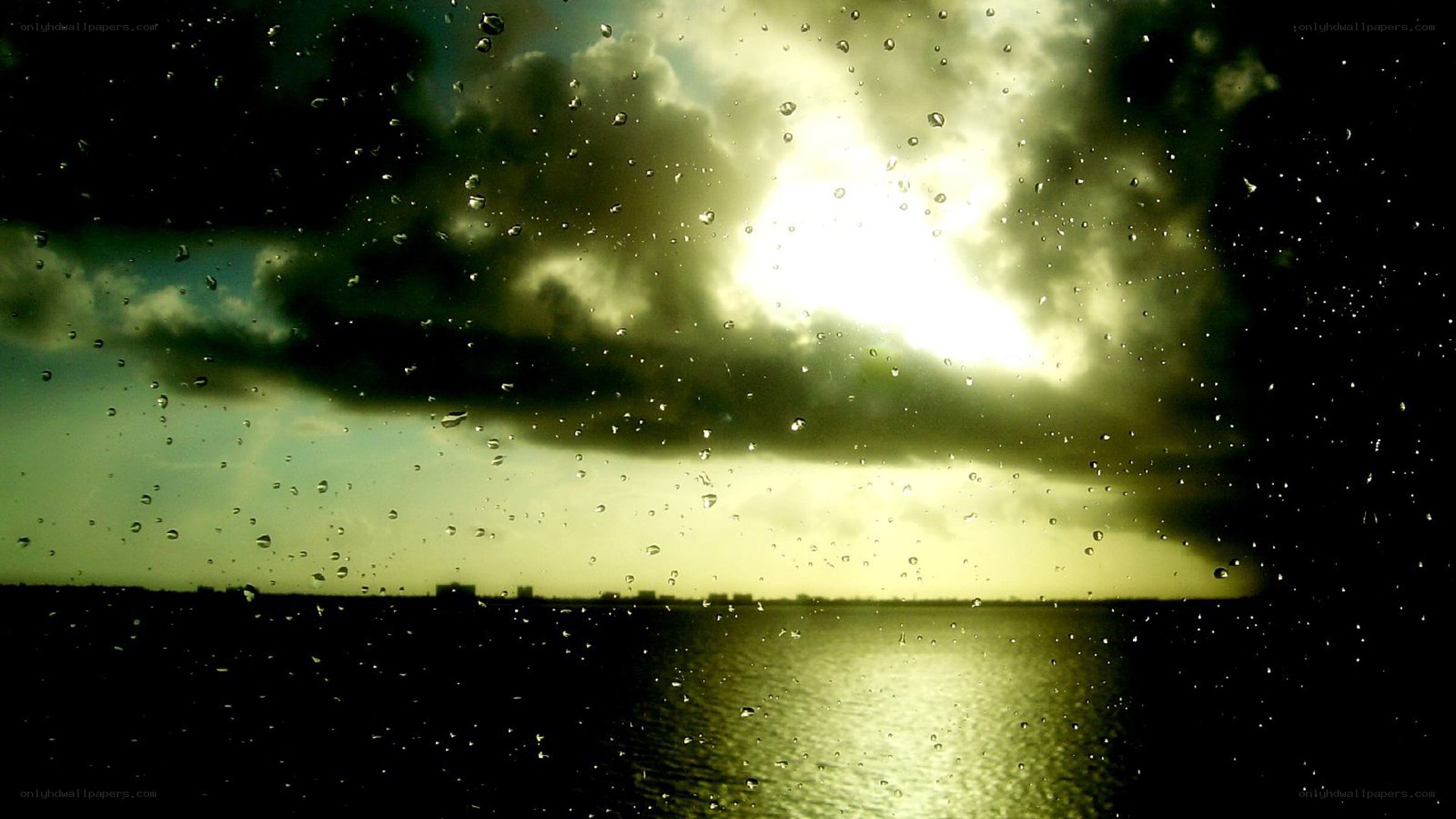 rainy sunset over water