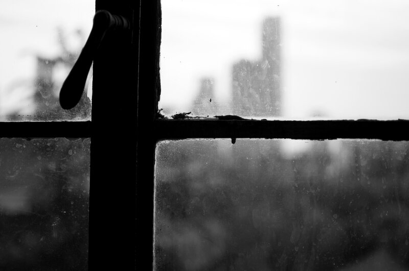 Rainy window view of city