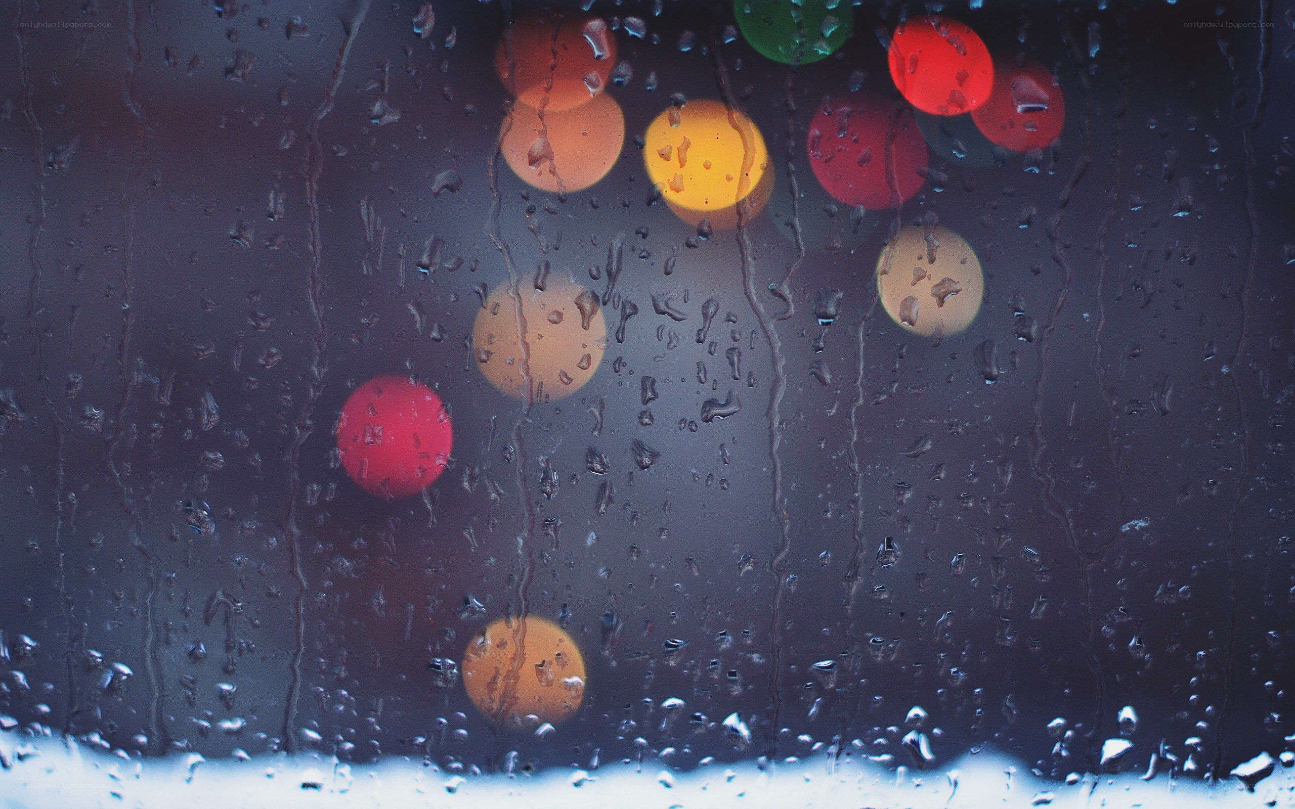 rainy window with bokeh lights