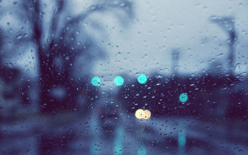 rainy window with city lights