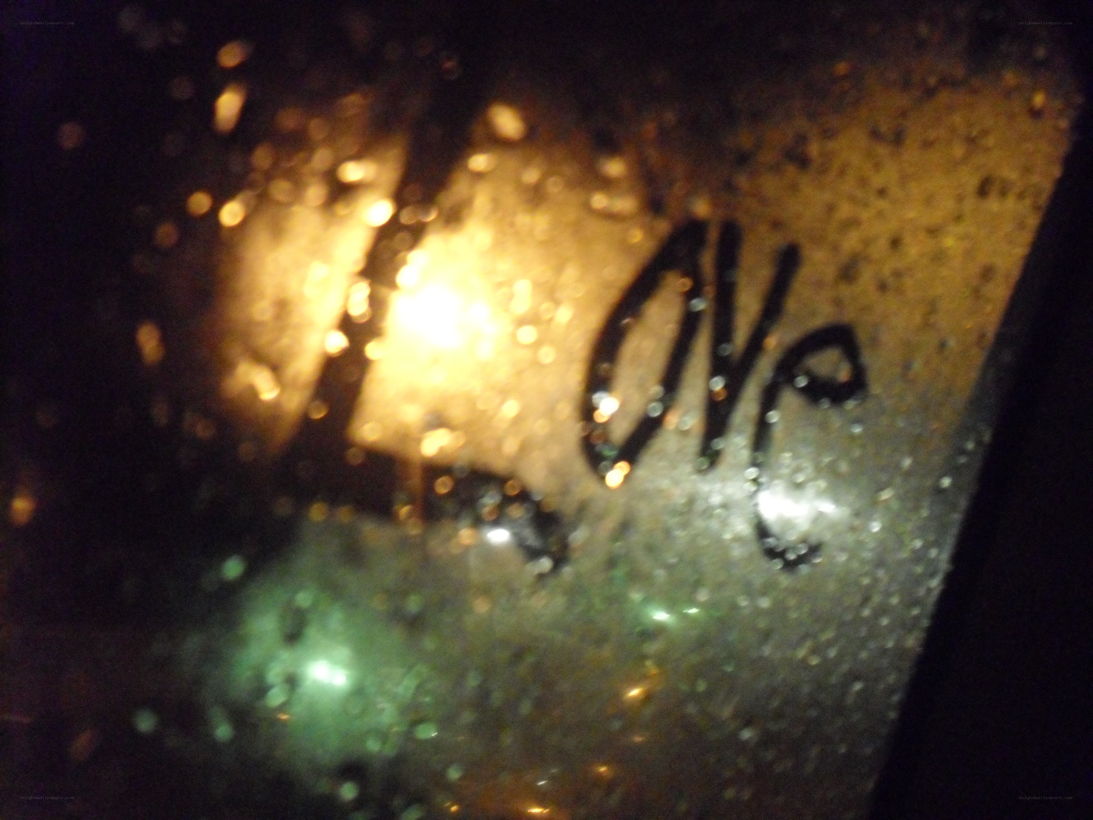 rainy window with love writing