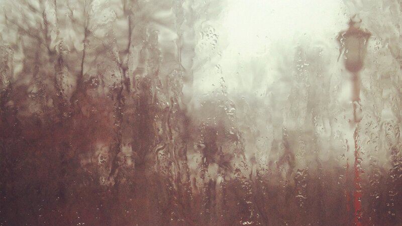 Rainy window with silhouette