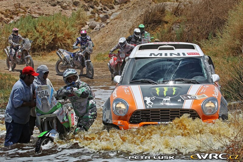 Rally car and motorcycles in water