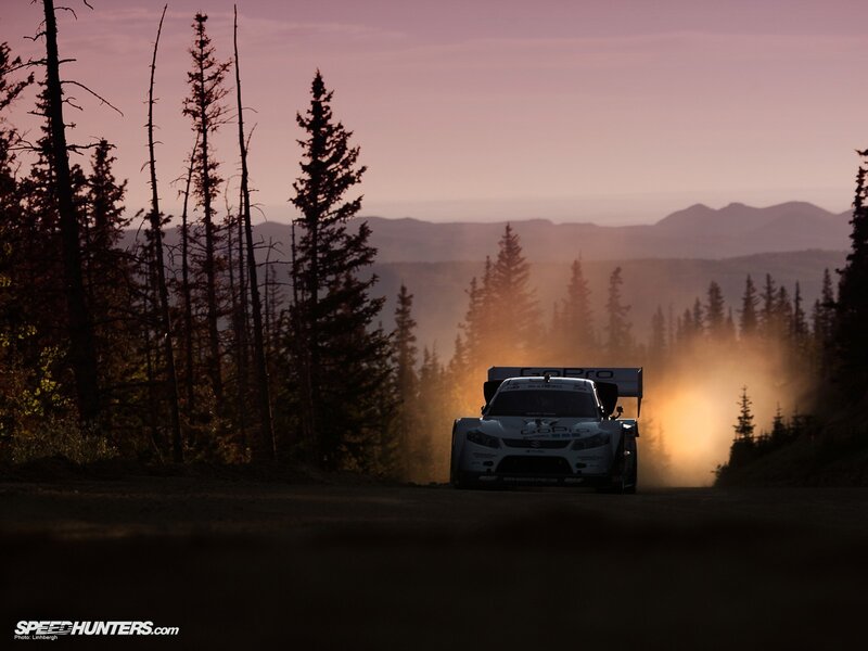 Rally car at dusk in the forest