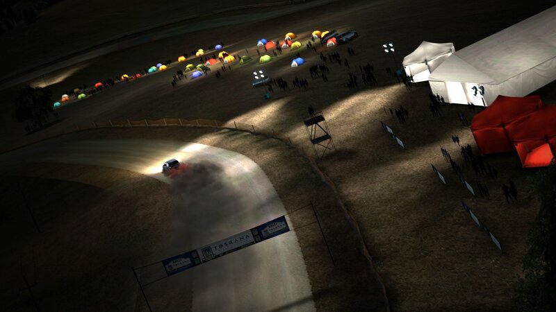 Rally car at night on dirt track