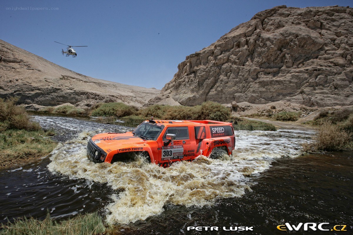 Rally car crossing river