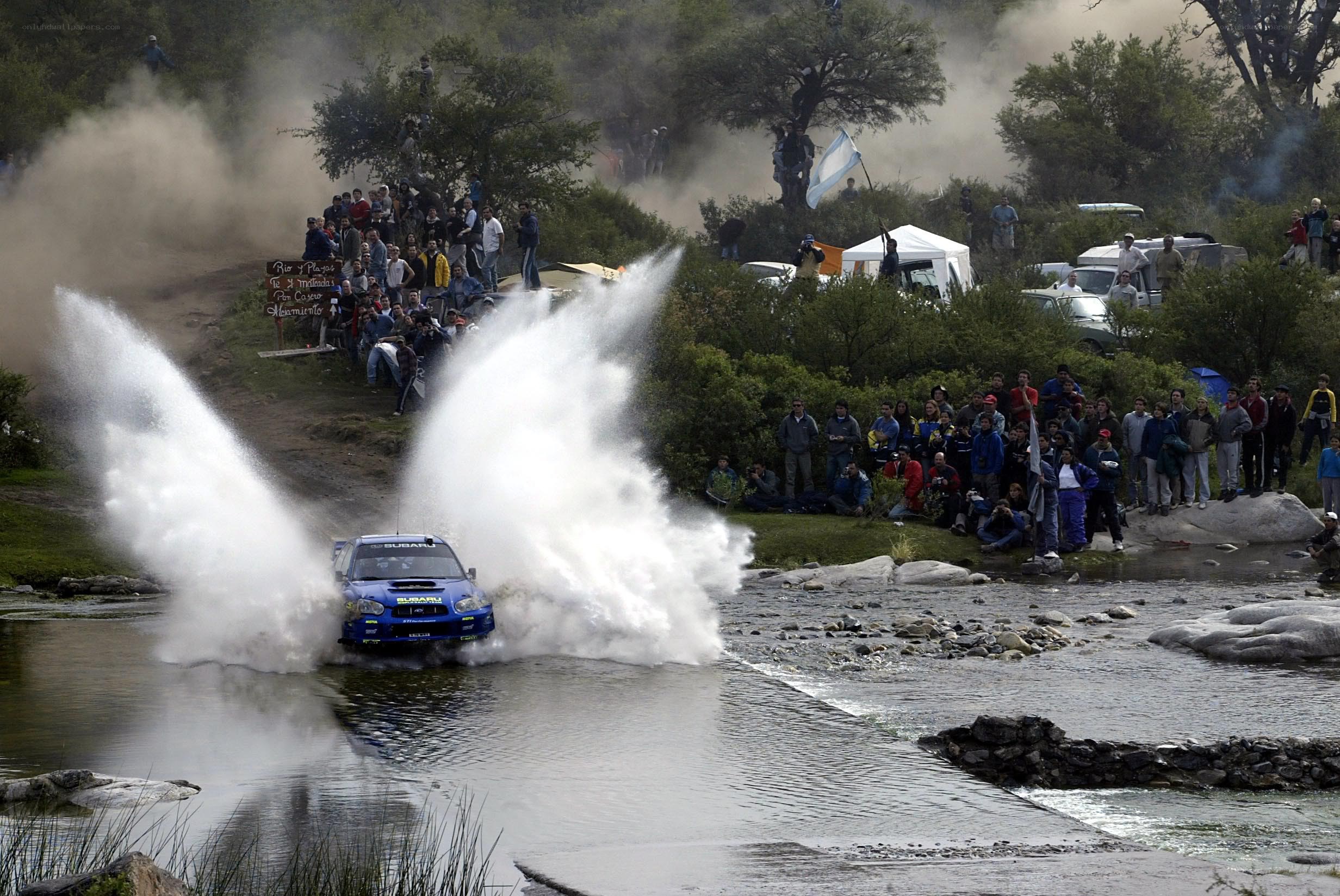 Rally car crossing river