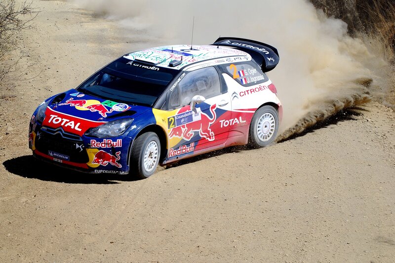 Rally car drifting on dirt