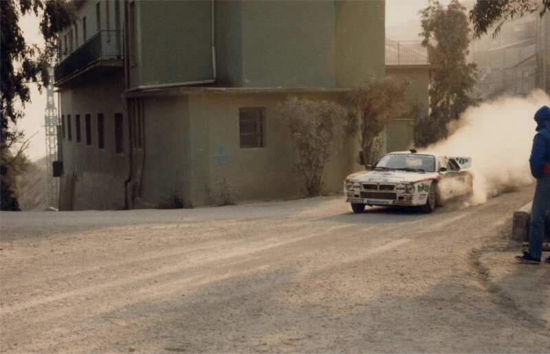 Rally car drifting on dirt road