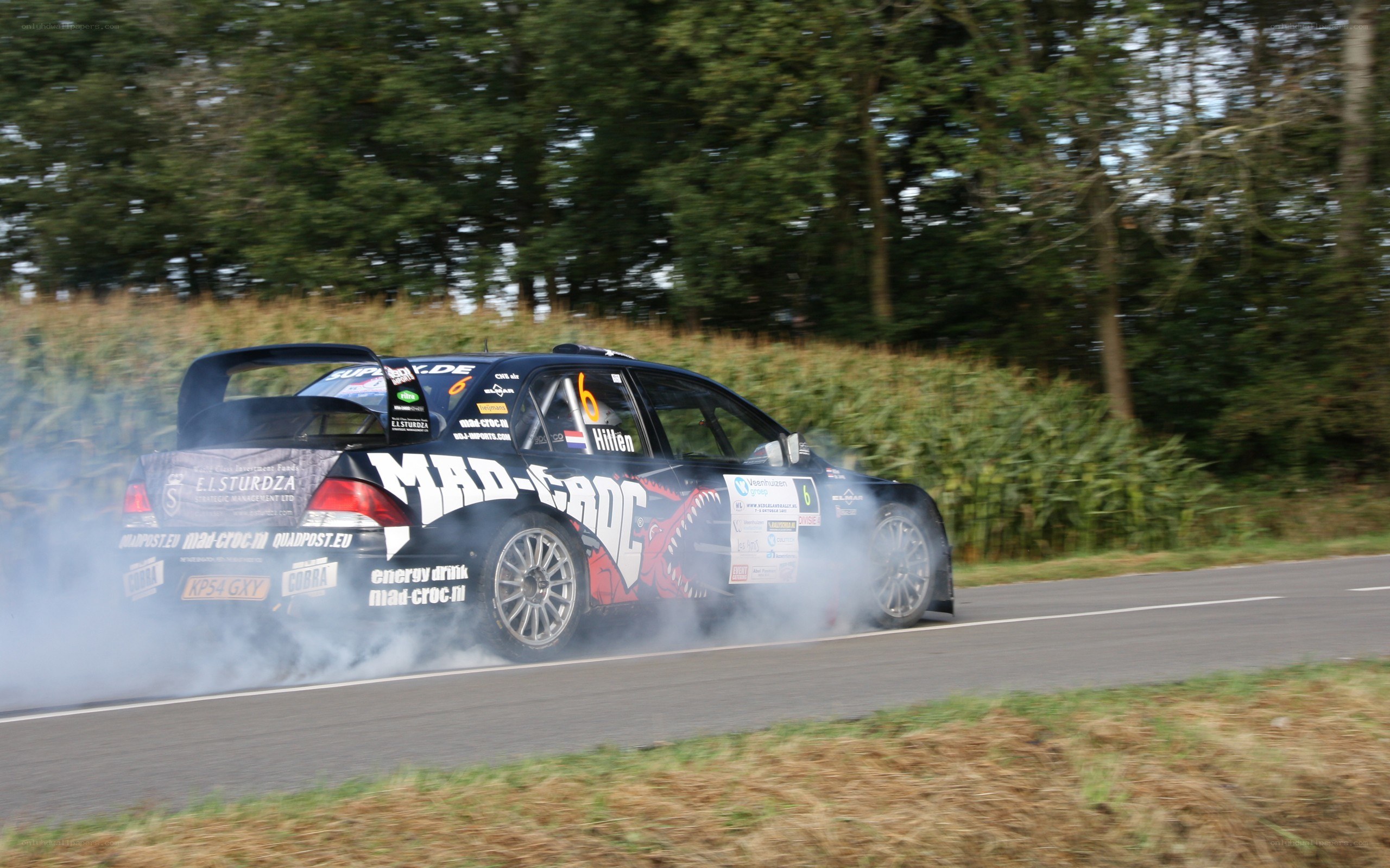 Rally car drifting on road