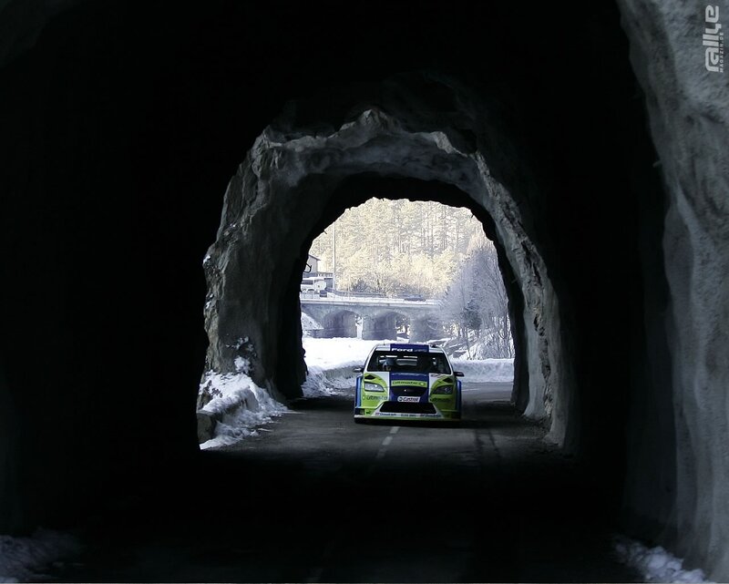 Rally car exiting tunnel