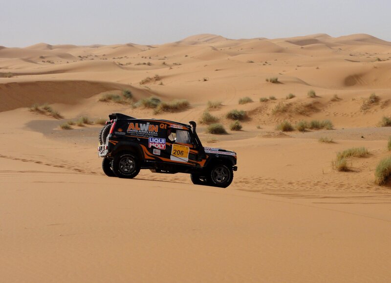 Rally Car in Desert — Brown, Arid, Afternoon