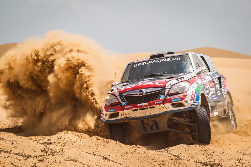 Rally Car in Desert — Brown, Dynamic, Afternoon, Photograph, Sand Dunes, Dust Cloud