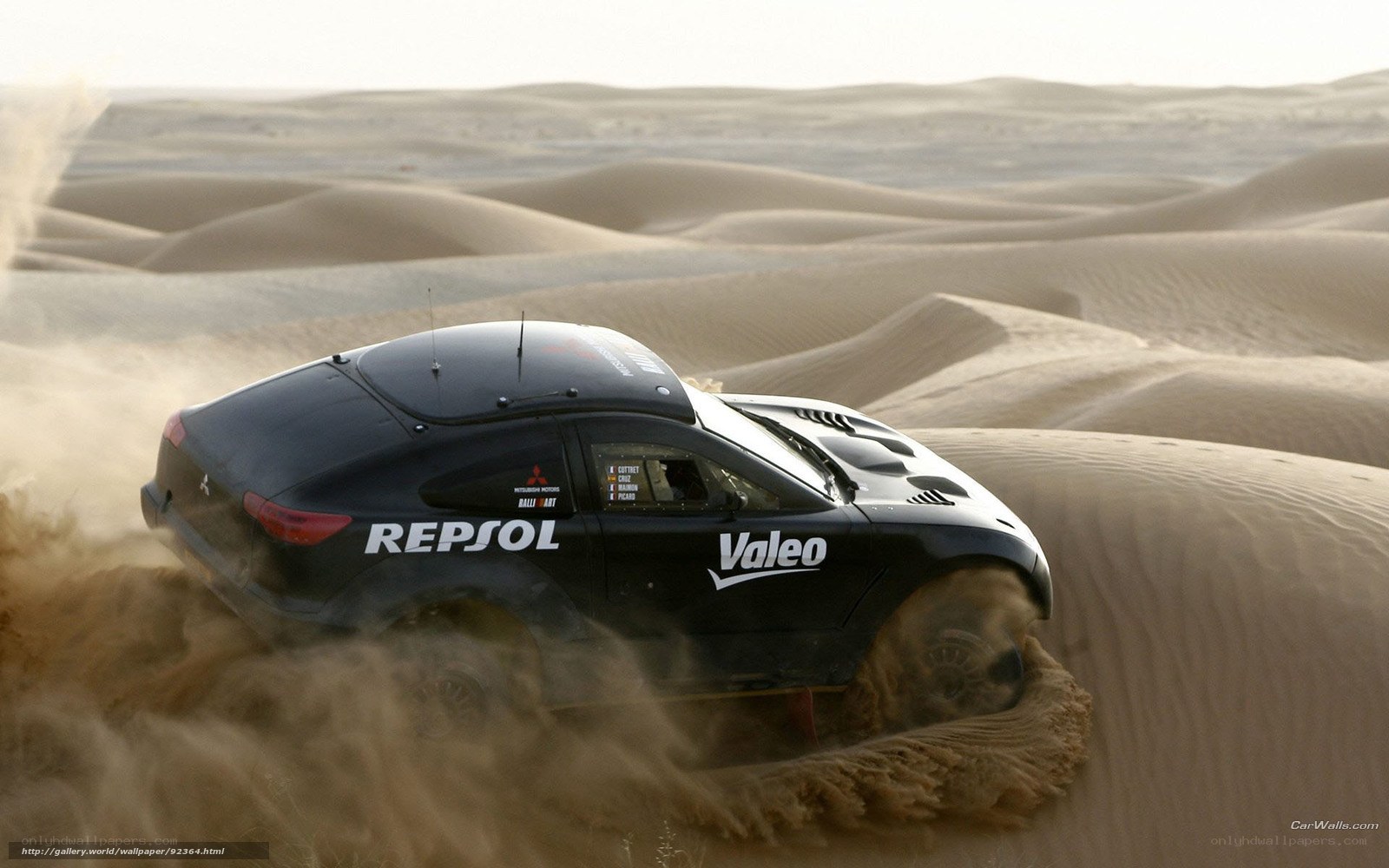 Rally car in desert dunes