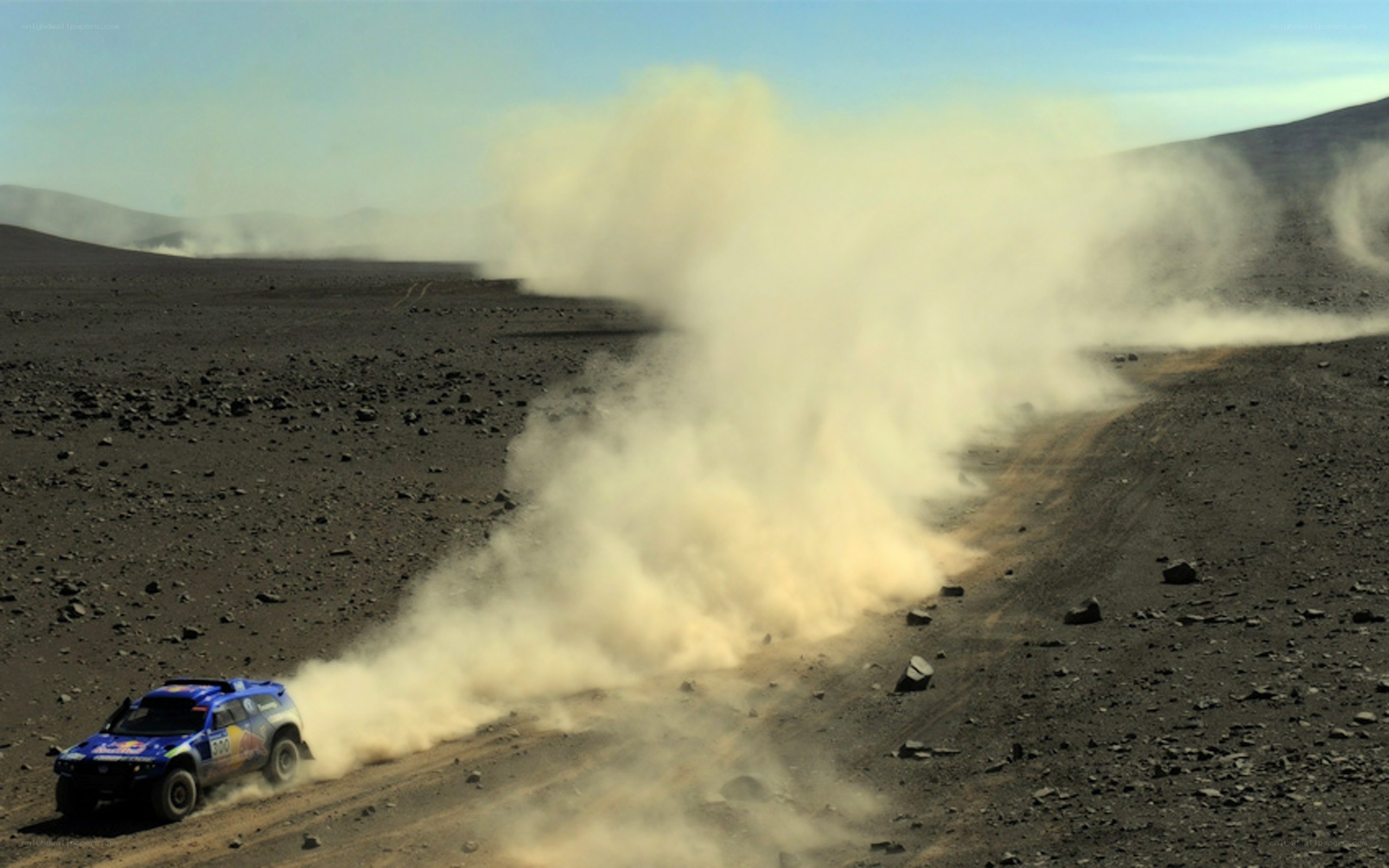 Rally car in desert dust