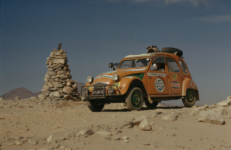 Rally car in desert landscape