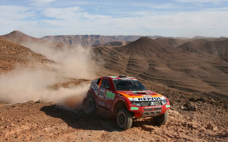 Rally car in desert terrain