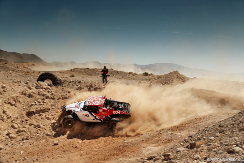 Rally car in desert terrain