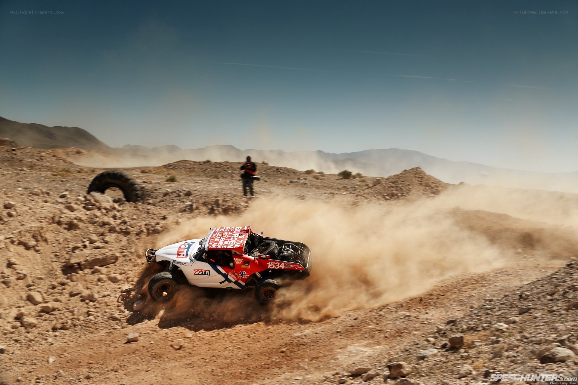 Rally car in desert terrain