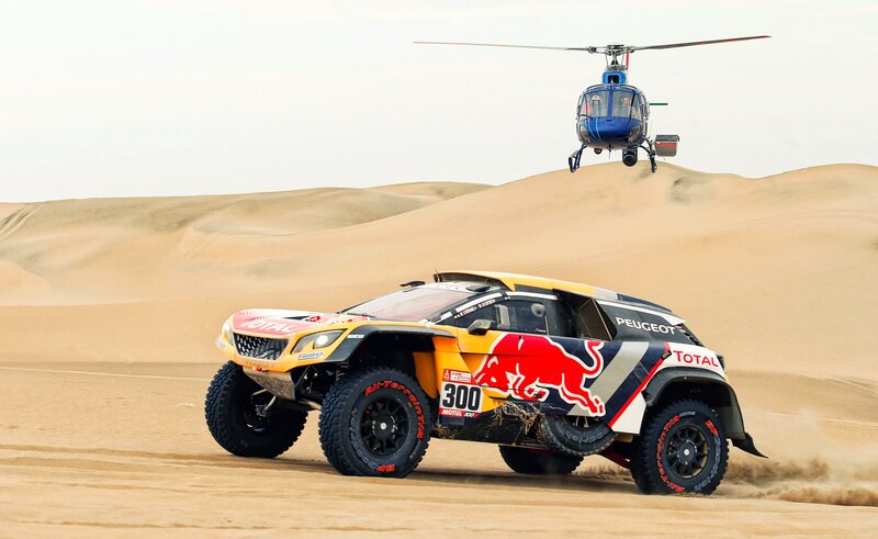 Rally Car in Desert — Yellow, Dynamic, Afternoon, Photograph, Helicopter