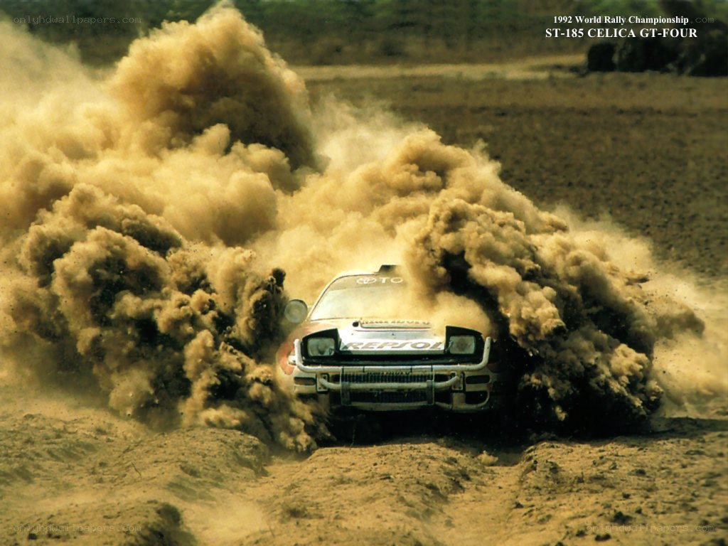 Rally car in dust cloud