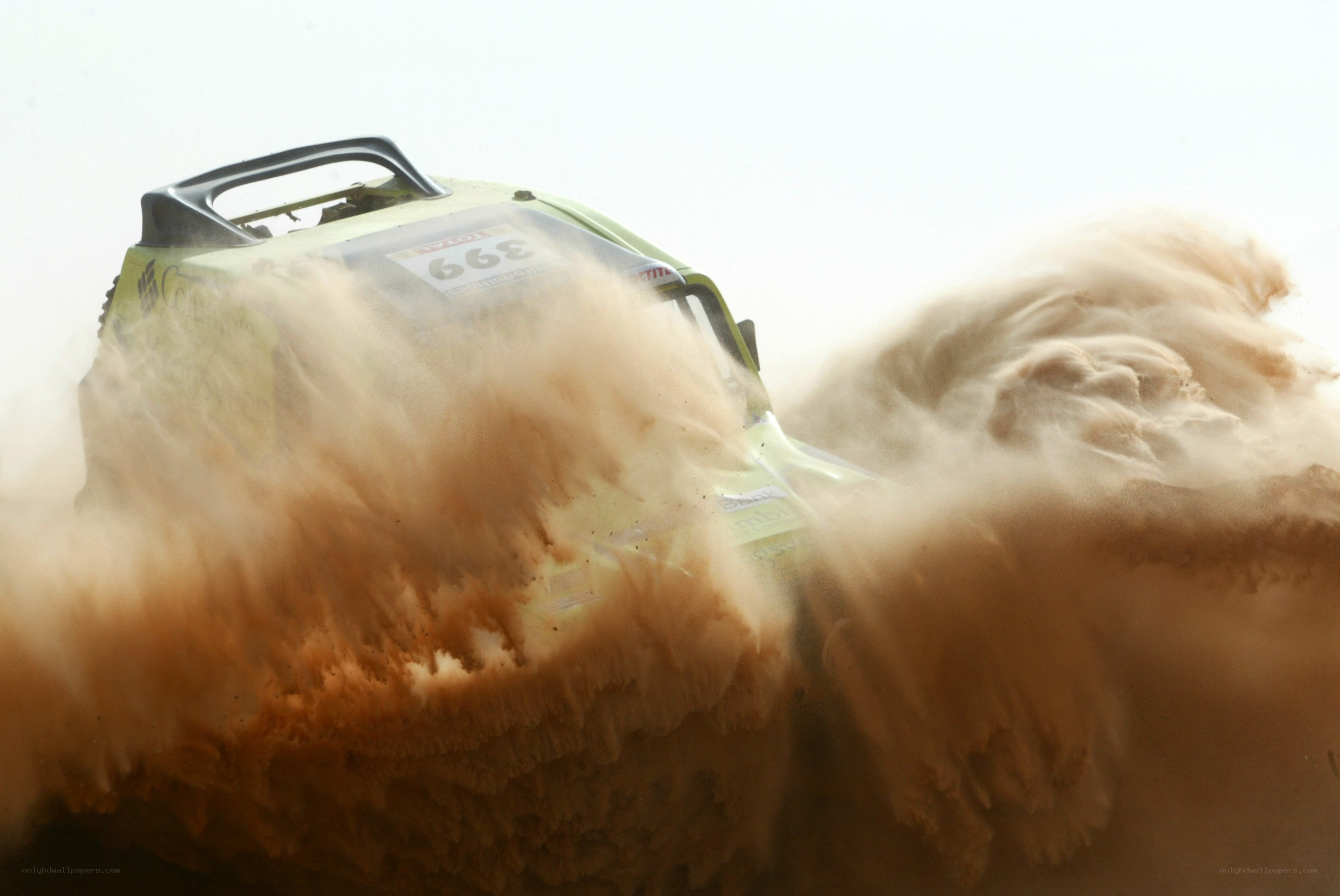 rally car in dust storm