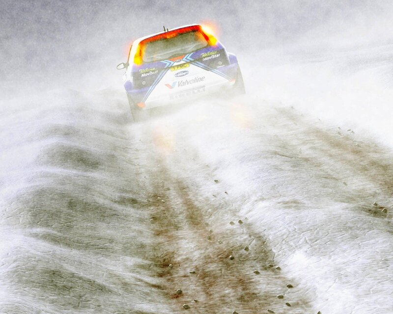 Rally car in dusty terrain