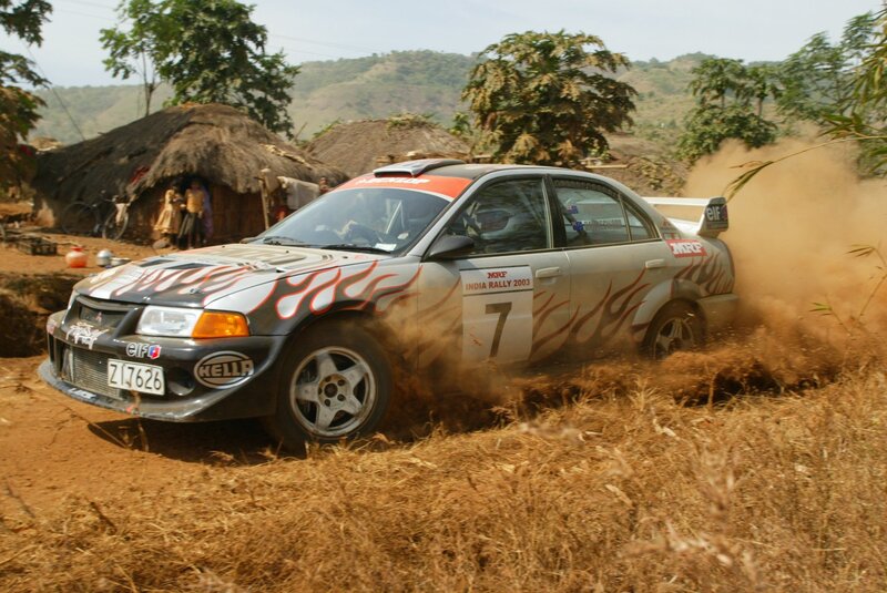 Rally car in dusty village