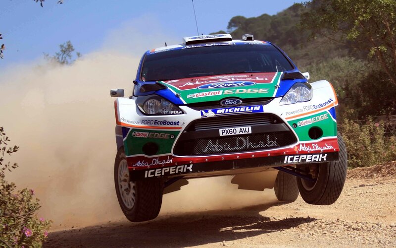 Rally Car in Mid-air — Blue, Dynamic, Afternoon, Photograph, Dust