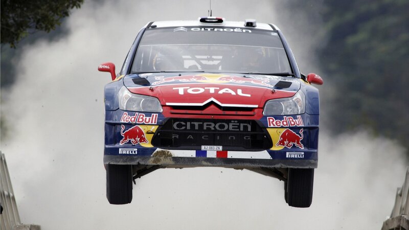 Rally Car in Mid-air — Blue, Dynamic, Photograph, Dust Cloud