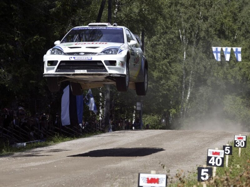 Rally car in mid-air jump