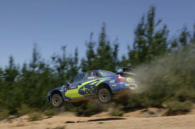 rally car in mid-air jump