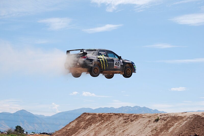 rally car in mid-air jump