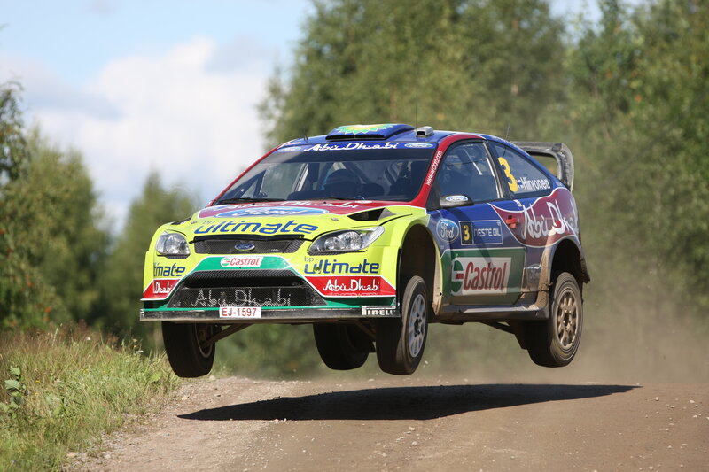 rally car in mid-air jump