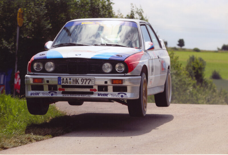 rally car in mid-air jump