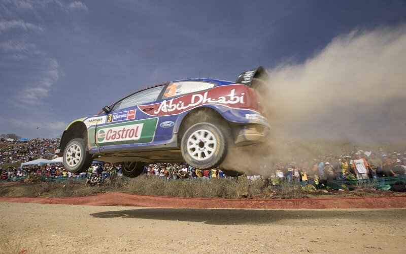 Rally car in mid-air jump
