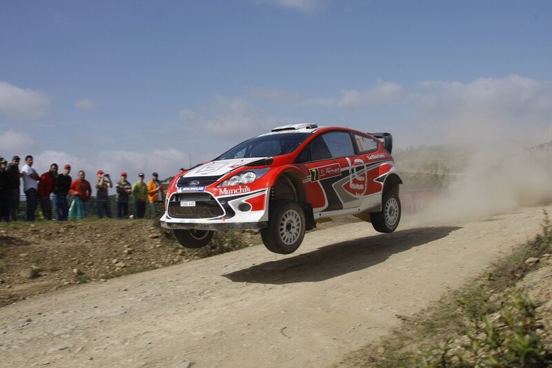 Rally car in mid-air jump