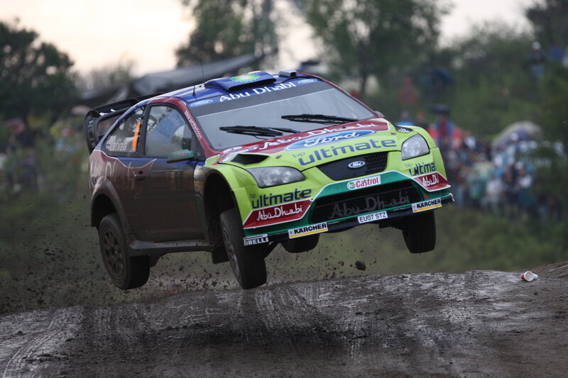 Rally car in mid-air jump