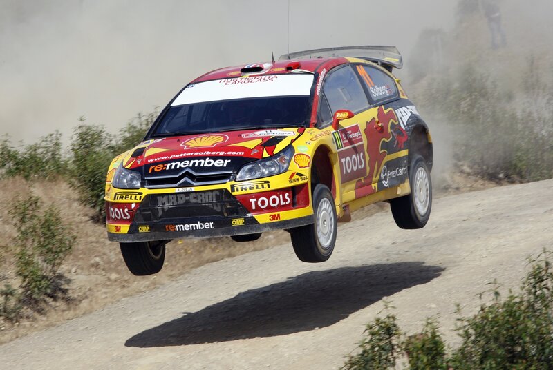 Rally car in mid-air jump