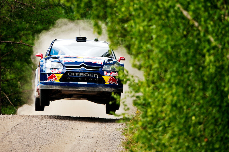 rally car in mid-air jump