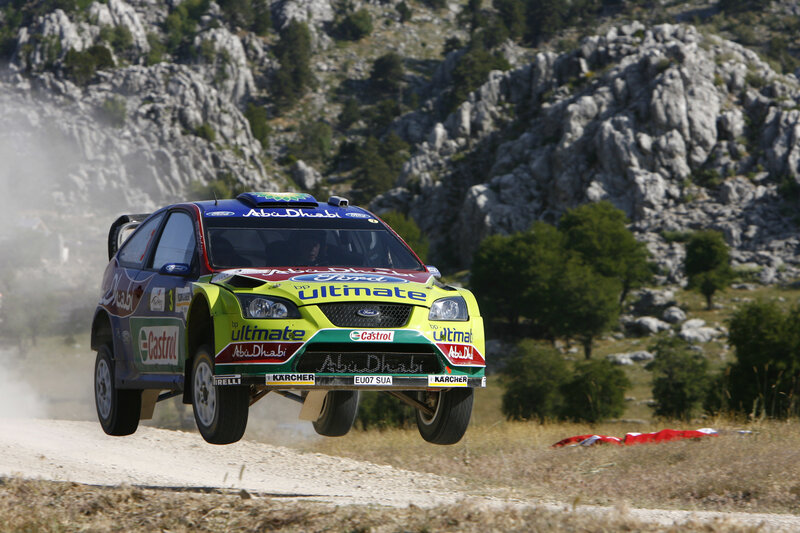 Rally car in mid-air jump